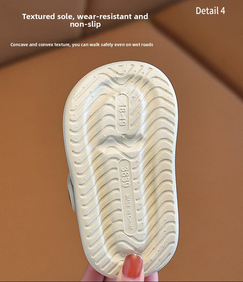 Textured sole of a shoe with wear-resistant and non-slip properties, held by a hand.